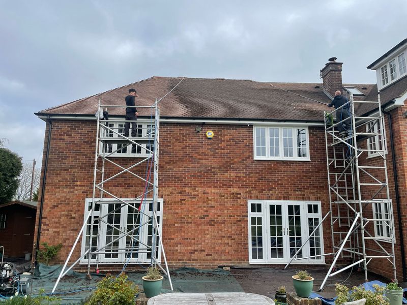 Roof cleaning carried out safely from scaffold towers by The Roof Moss Cleaners in Lyneham